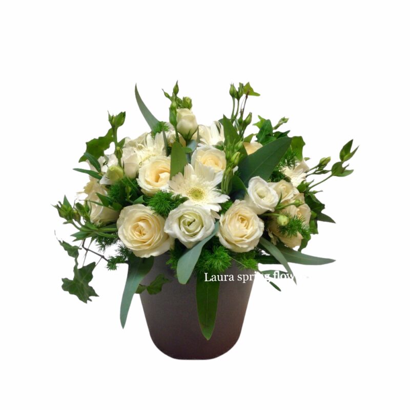 White shades composition with various flowers in clay vase